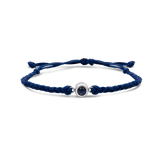 Navy blue braided bracelets with a black bead charm in silver color