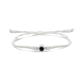White braided bracelets with a black bead charm in silver color