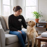 Woman sitting on a couch with a dog in a cozy living room