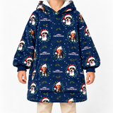 A person wearing a navy blue hooded sweatshirt with an all-over Christmas print featuring Saint Bernard dog faces, Santa hats, holly leaves, and the text 'Christmas Watson'.