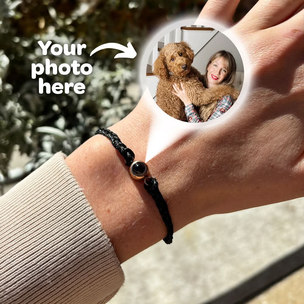 Black adjustable bracelet showing the photo inside the charm.