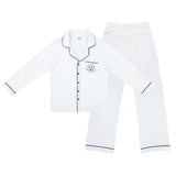 Premium women’s bamboo pajama set in ivory which contains a long sleeve shirt with buttons and a long pants. Custom pet portrait on the chest pocket