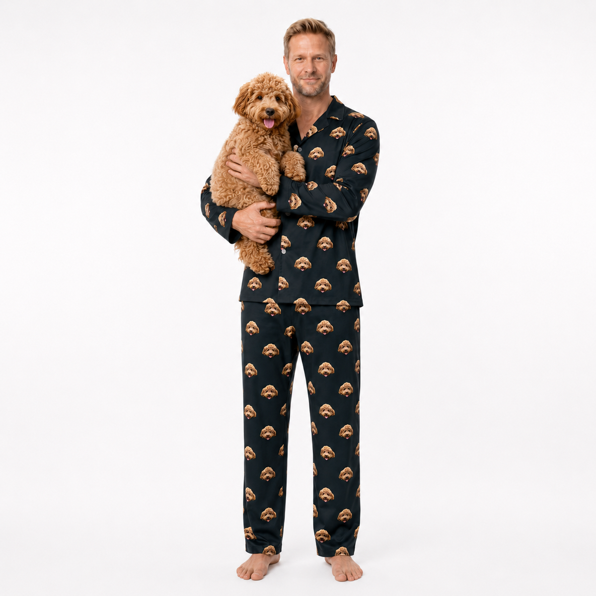 Man wearing a black pajama set with brown dog pattern, holding a brown dog on a white background