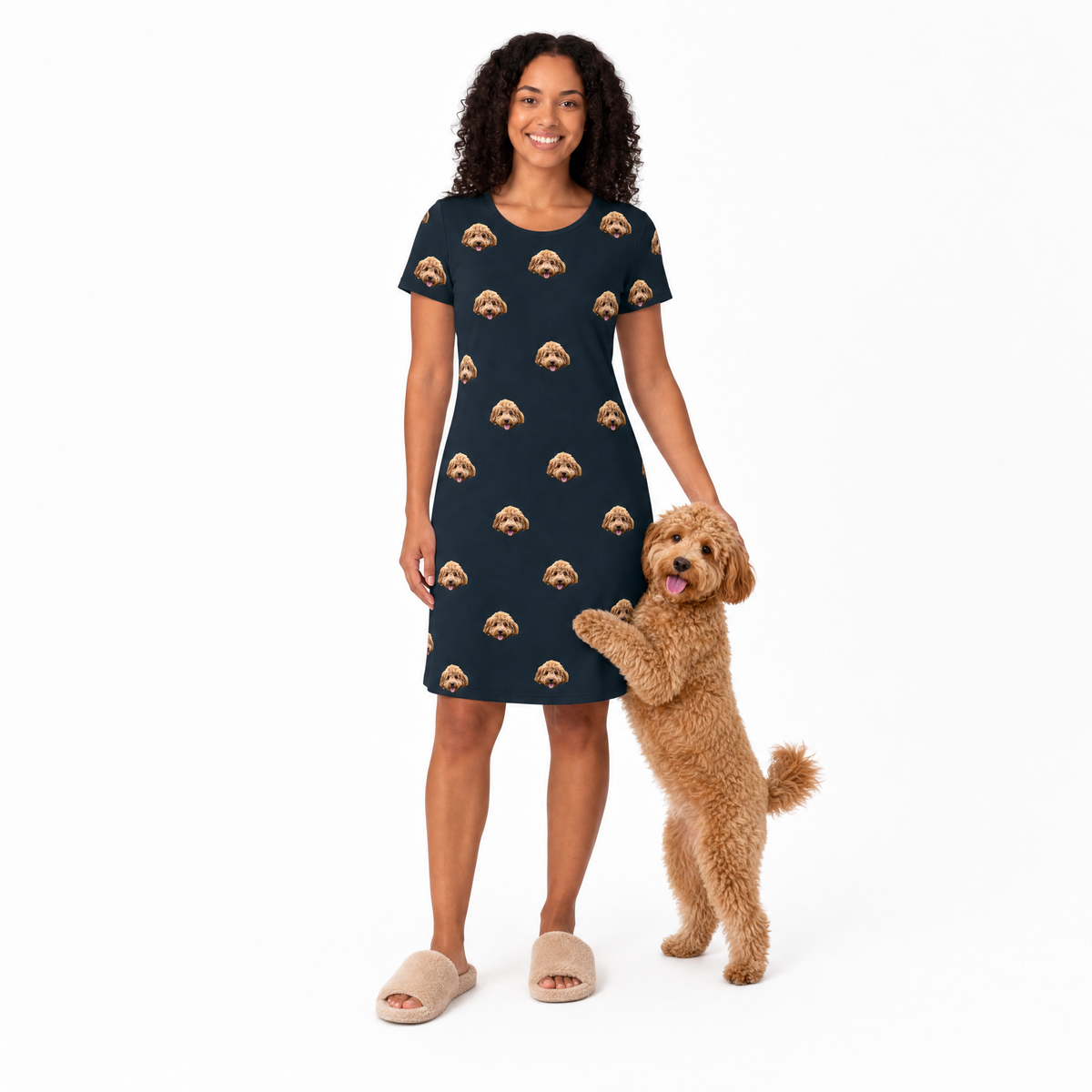 Woman wearing a black night gown with dog pattern holding a dog on a white background