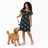 Black kids fleece blanket hoodie theme – person in dog-print dress playing with curly-haired dog.