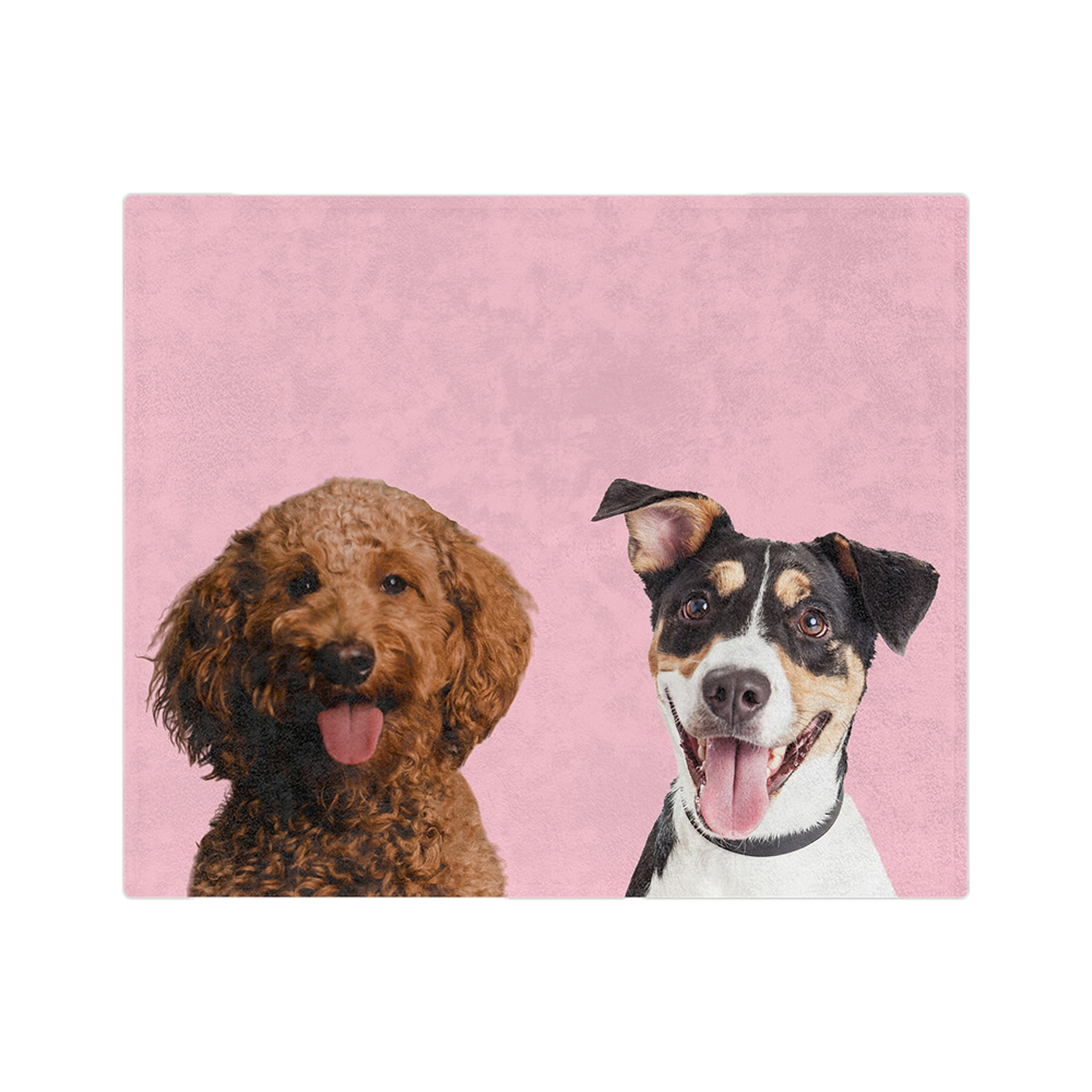 Pink blanket featuring the portraits of two dogs.
