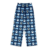 A pair of navy blue pajama pants featuring a repeating pattern of a French Bulldog's face inside a circular frame, with the text 'French Bulldog' in light blue, surrounded by white snowflakes.