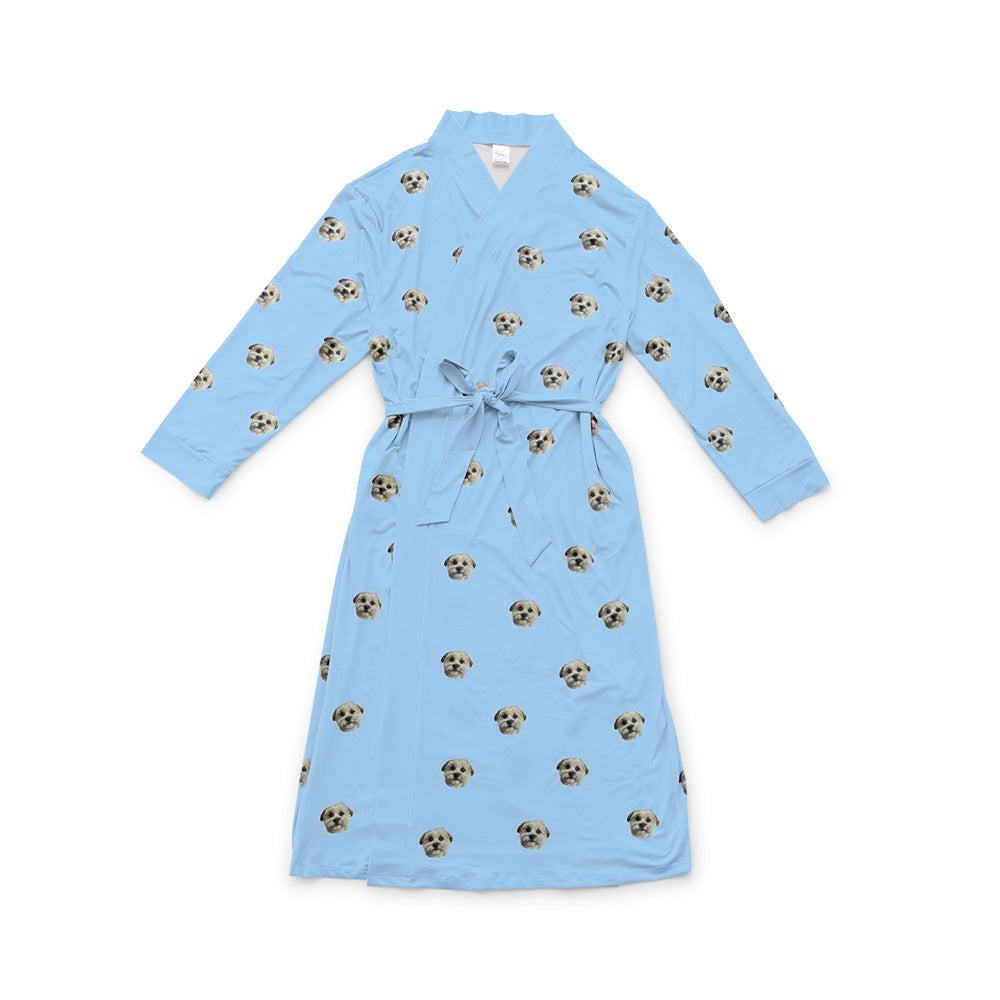 Sky blue robe with a waist tie and an all-over print of small dog faces, shown on a white background