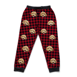 Red and black checkered sweatpants with a dog's face pattern on a white background