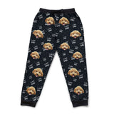 Black pajama pants with dog face pattern on a white background