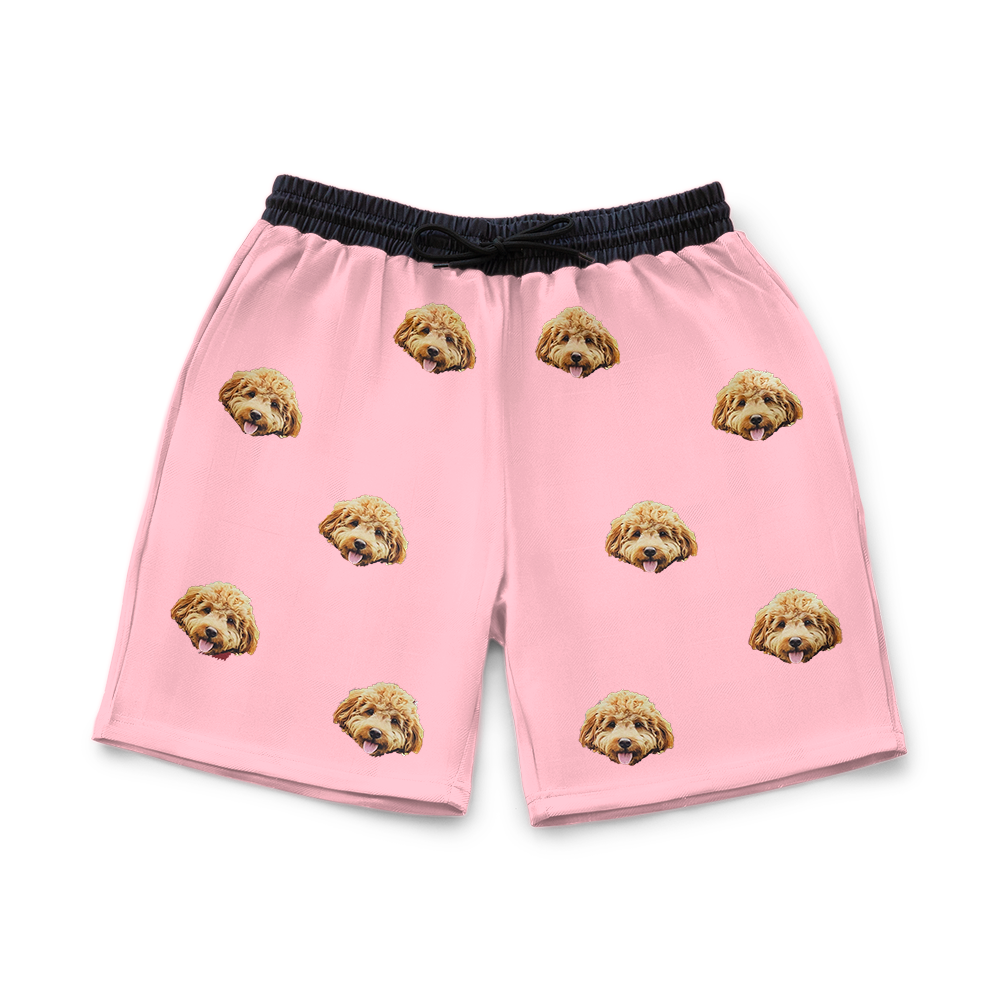 Pink shorts with dog pattern on a white background