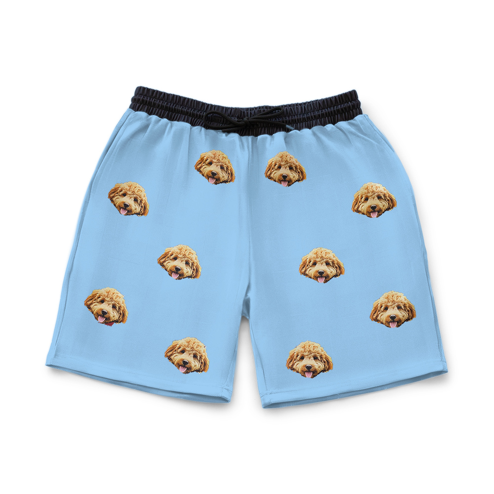 Sky blue shorts with dog pattern on a white background