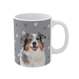 Gray ceramic mug with paws pattern, featuring a smiling, multicolored Australian Shepherd [SlateGrayPawsImageCutOut]