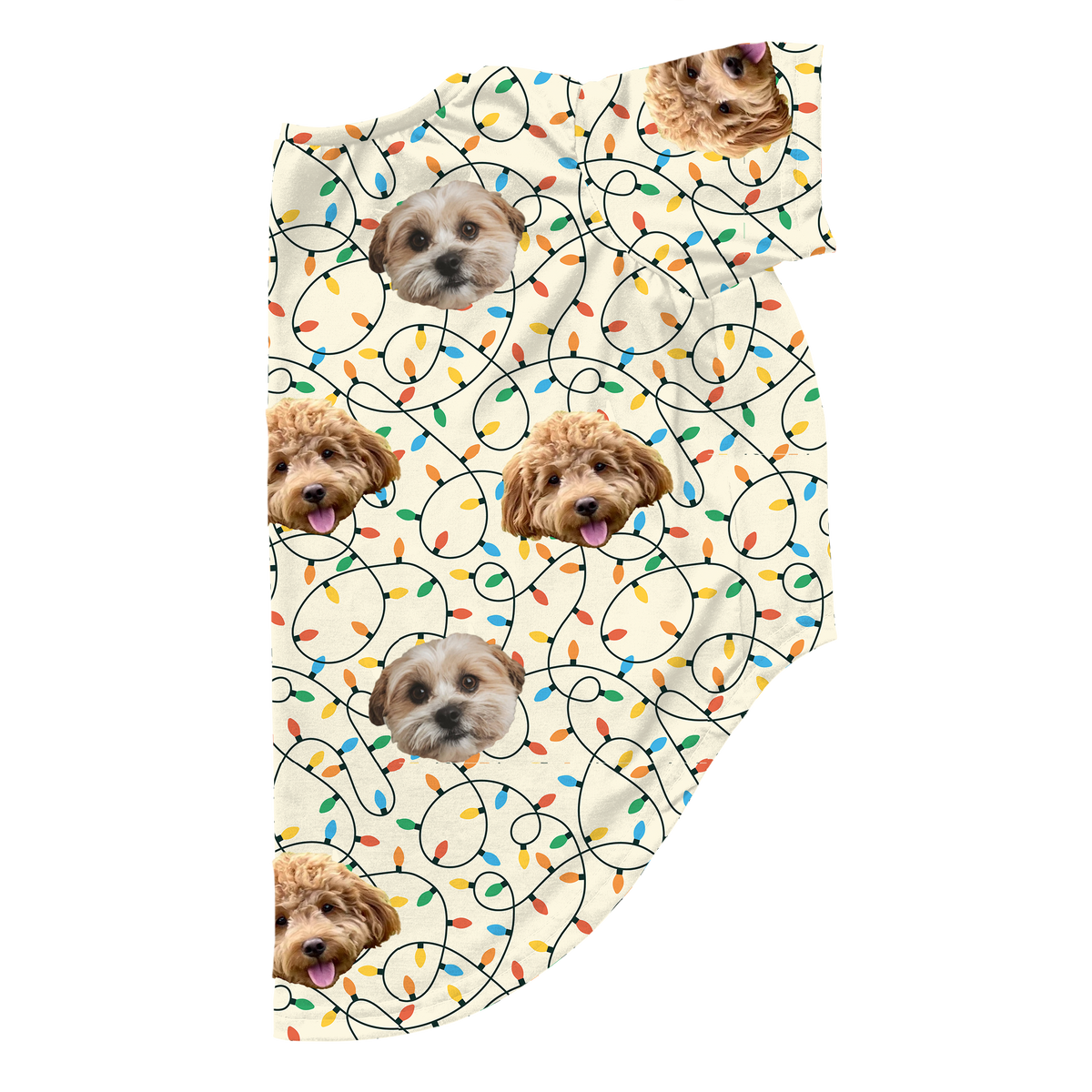 Custom dog pajamas with two different dog faces printed across a cream background decorated with colorful Christmas string lights. The design features repeated photos of a fluffy tan dog and a small white-and-tan dog placed among looping holiday lights.