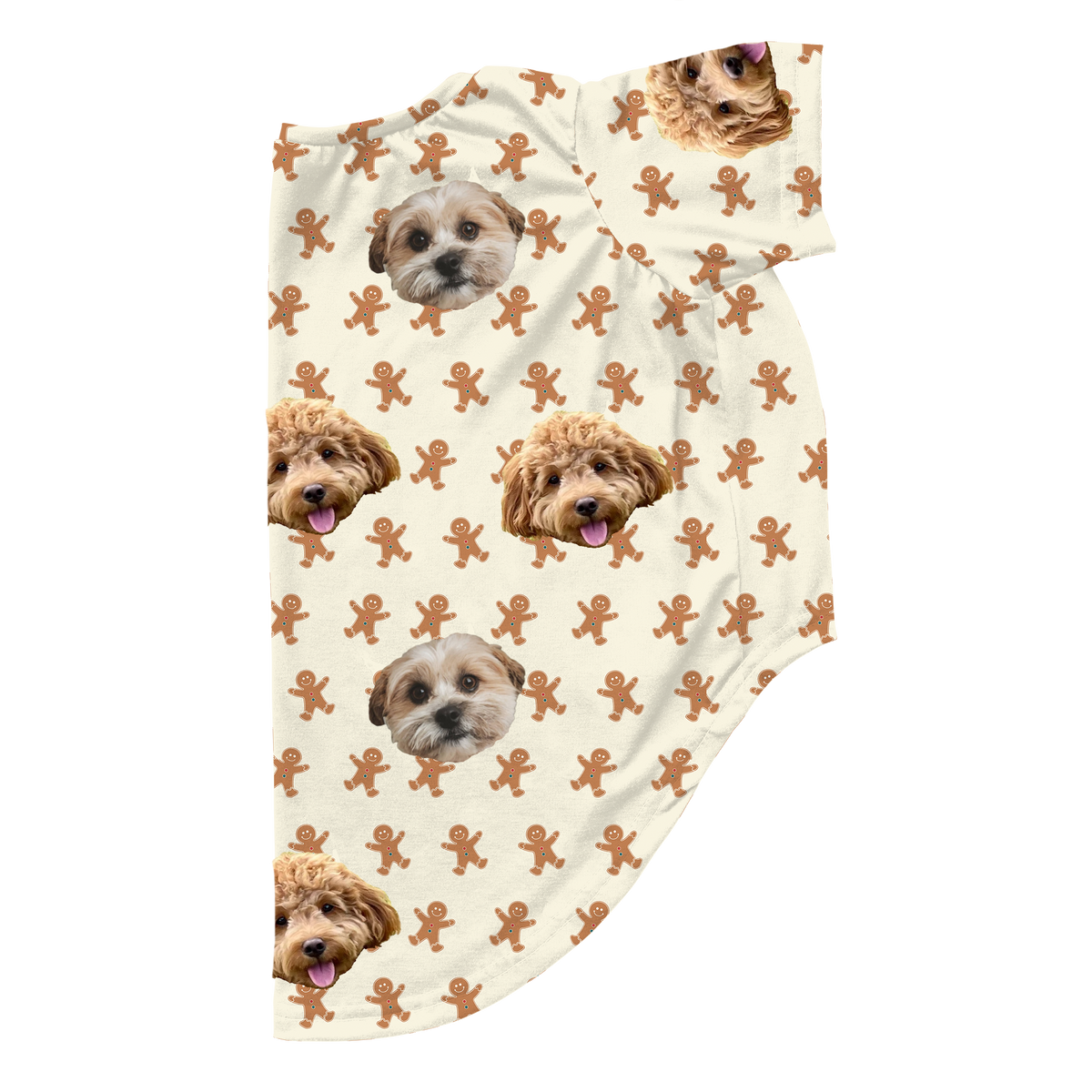 Cream-colored dog pajama outfit featuring a repeating gingerbread man pattern and two different small dog faces printed across the fabric.