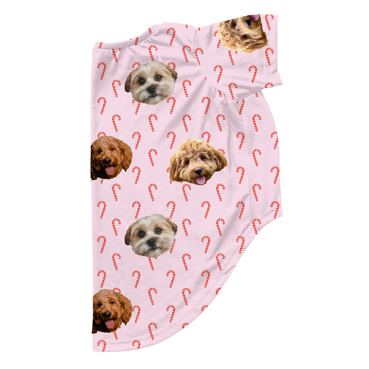 A pink dog pajama with a repeating candy cane pattern, decorated with three different dog faces placed throughout the fabric.