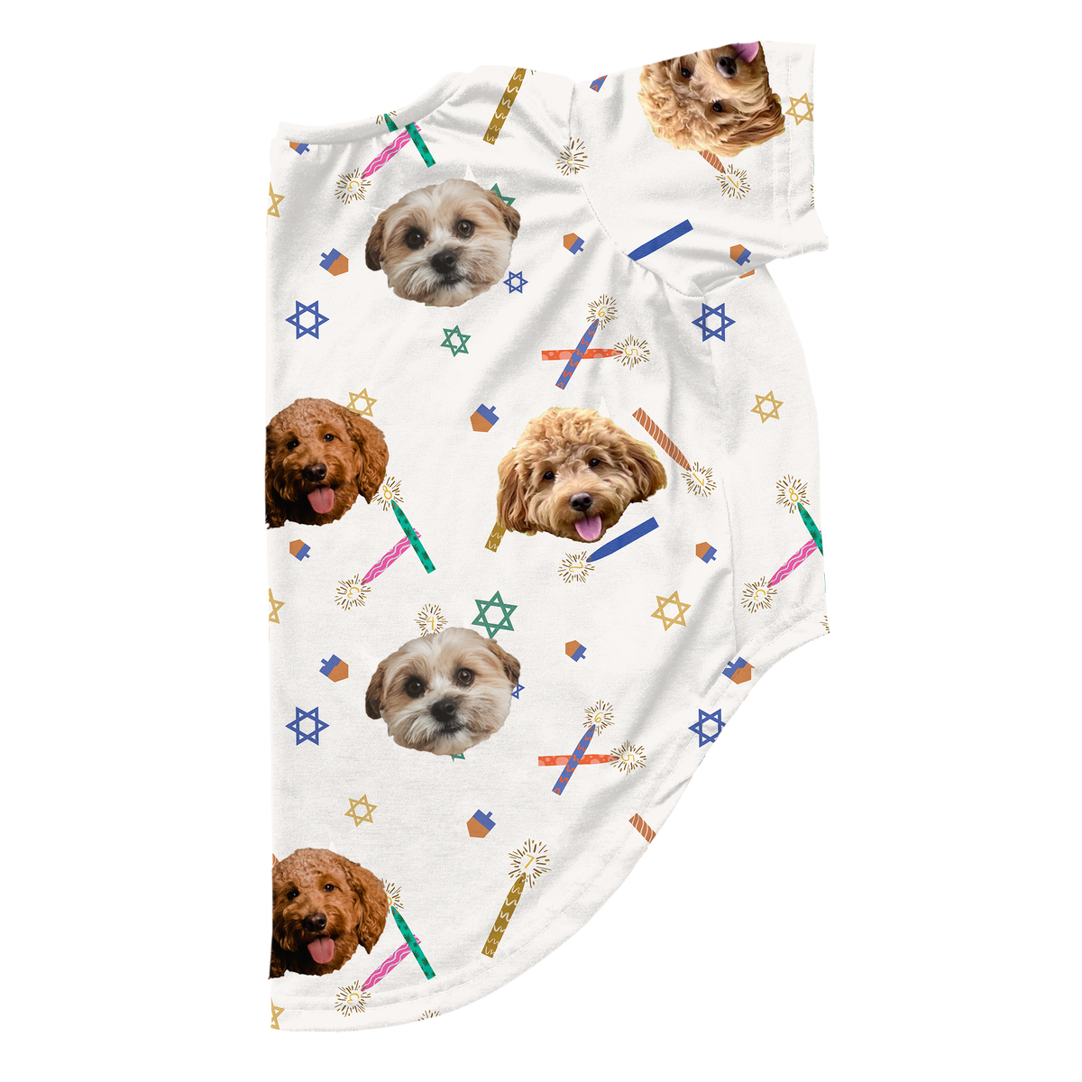 A piece of custom dog pajamas, cropped at the bottom and right side, featuring a white background. The pattern includes small Hanukkah-themed elements like blue and yellow Stars of David, dreidels, and colorful lit candles/sparklers. 