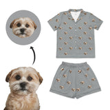 Customized kids' pajamas set with short sleeves and shorts, featuring face of a dog printed on them, alongside a photo of the dog.