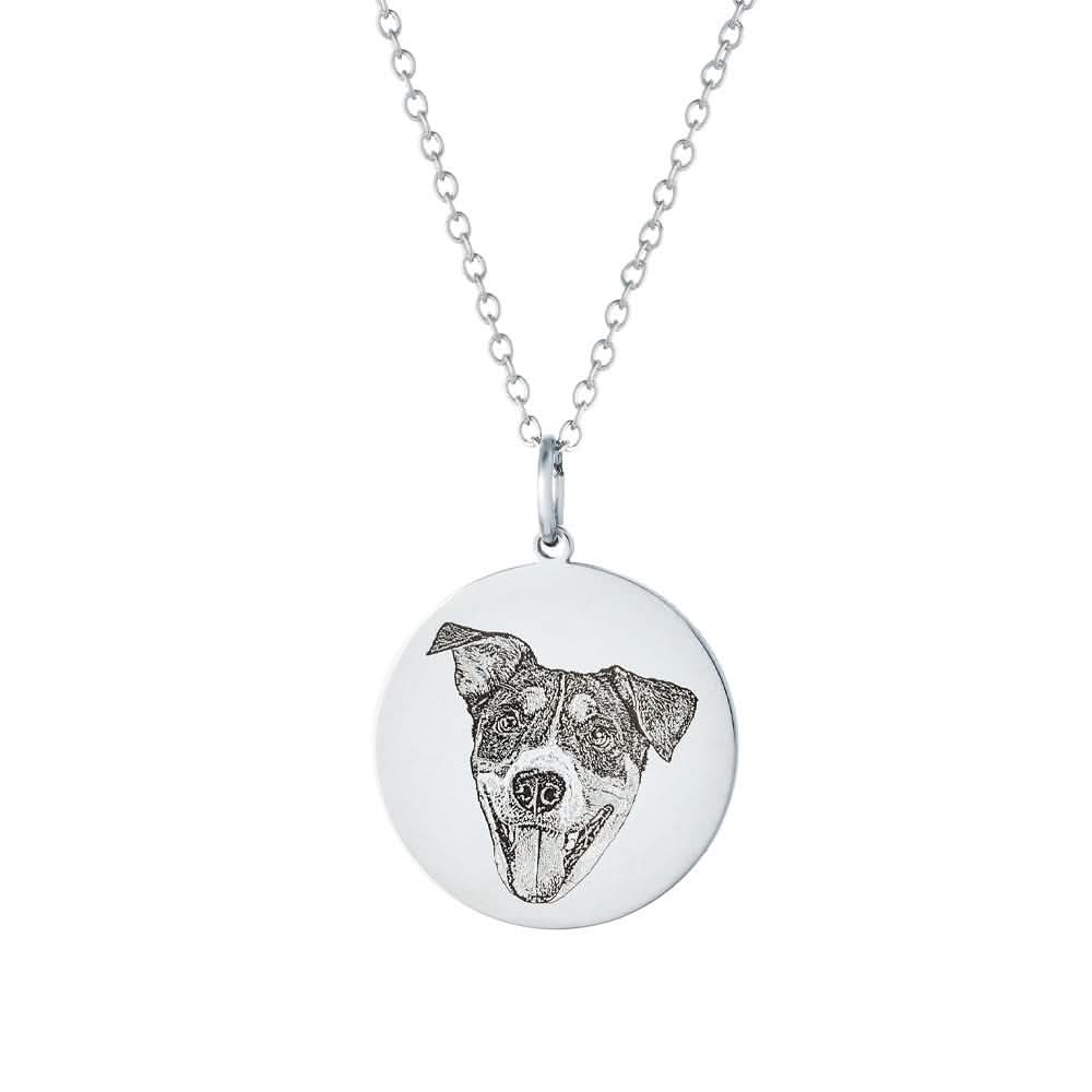 Silver circular dog-portrait necklace engraved.