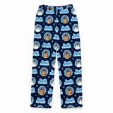 A pair of kids' leggings with a festive 'Frosted Snowman' pattern on a dark navy blue background. The pattern features circular snowman illustrations, snowflakes, and the text 'Frosted Snowman' in light blue and white.