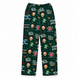 A pair of dark green Christmas-themed pajama pants featuring an all-over print of Mickey Mouse faces wearing Santa hats, holiday quotes, and festive icons on a white background.