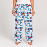 A person wearing light blue pajama pants with a repeating cartoon polar bear print, shown from the waist down against a plain light gray studio background.