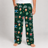 A person wearing dark green Christmas-themed pajama pants with a repeating print of a dog's face, Santa hats, musical notes, and holiday text, shown against a light gray studio background.
