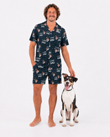 Man wearing a i love dad pajama set with a dog on a white background
