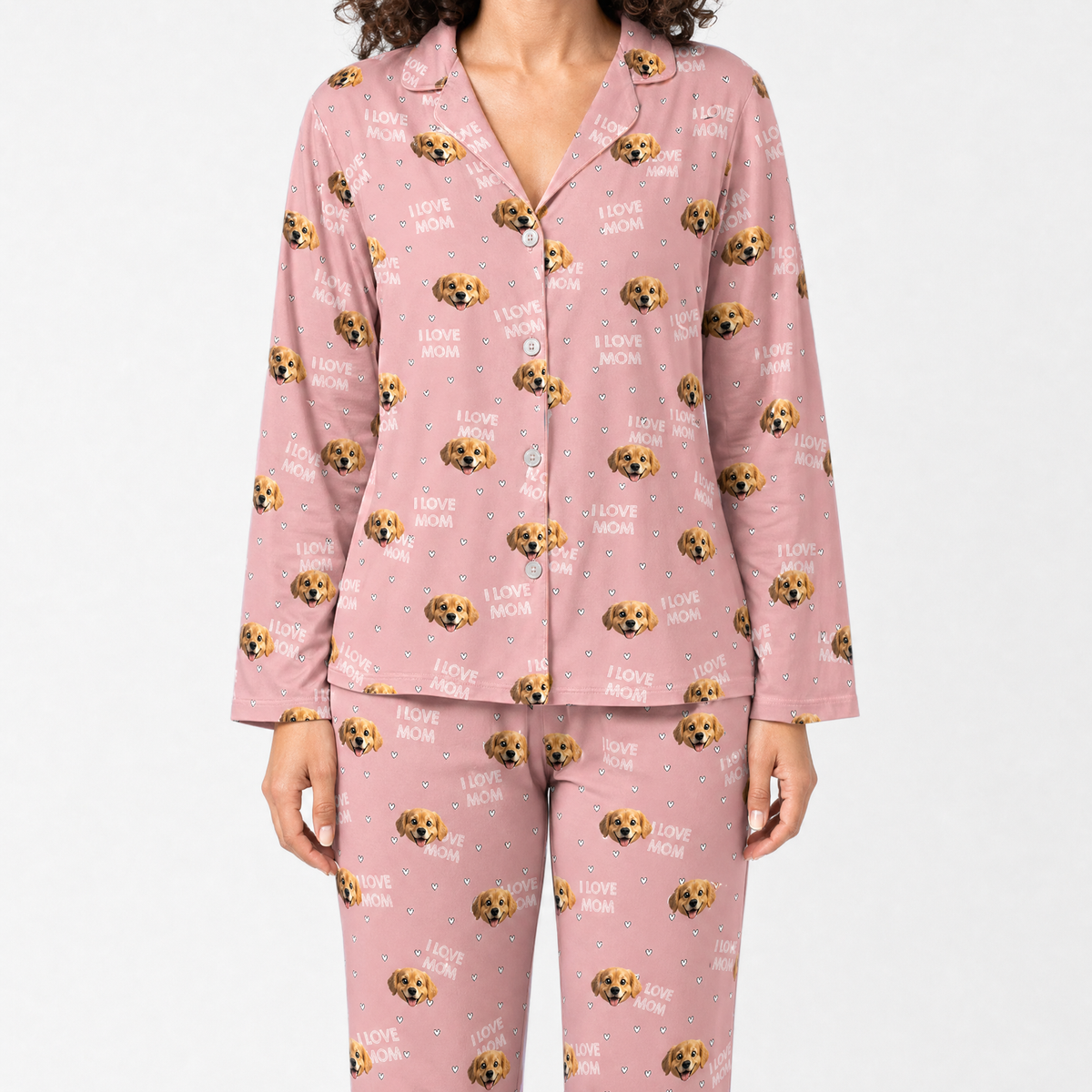 Pink pajama set with dog pattern on a white background