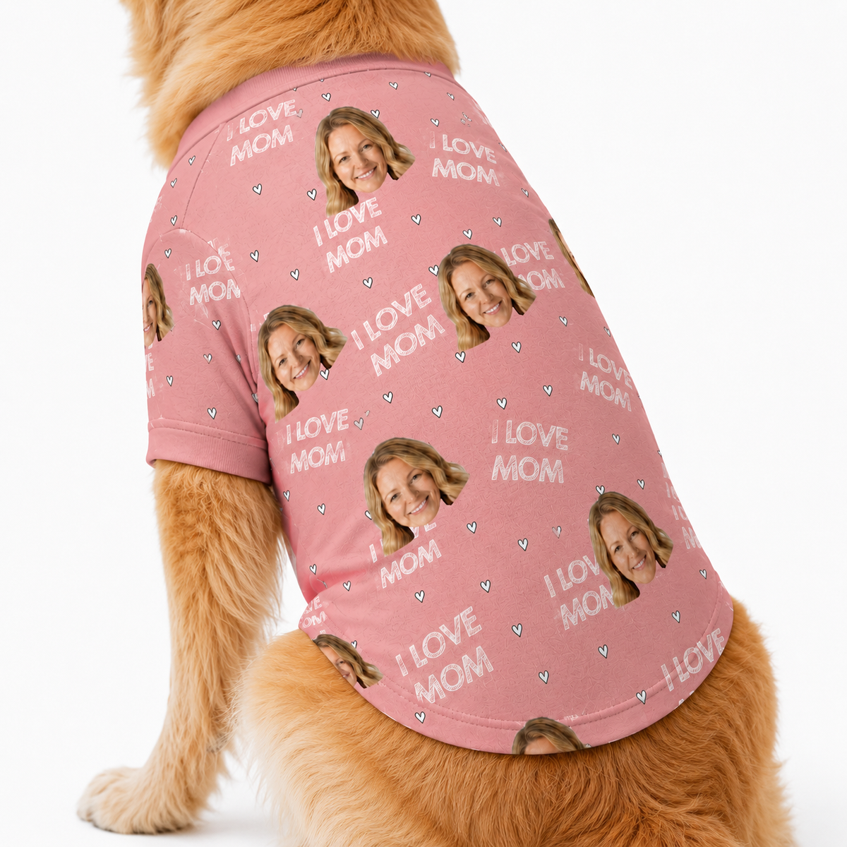 Dog wearing a pink custom dog shirt with “I Love Mom” text, hearts, and a repeating face pattern.