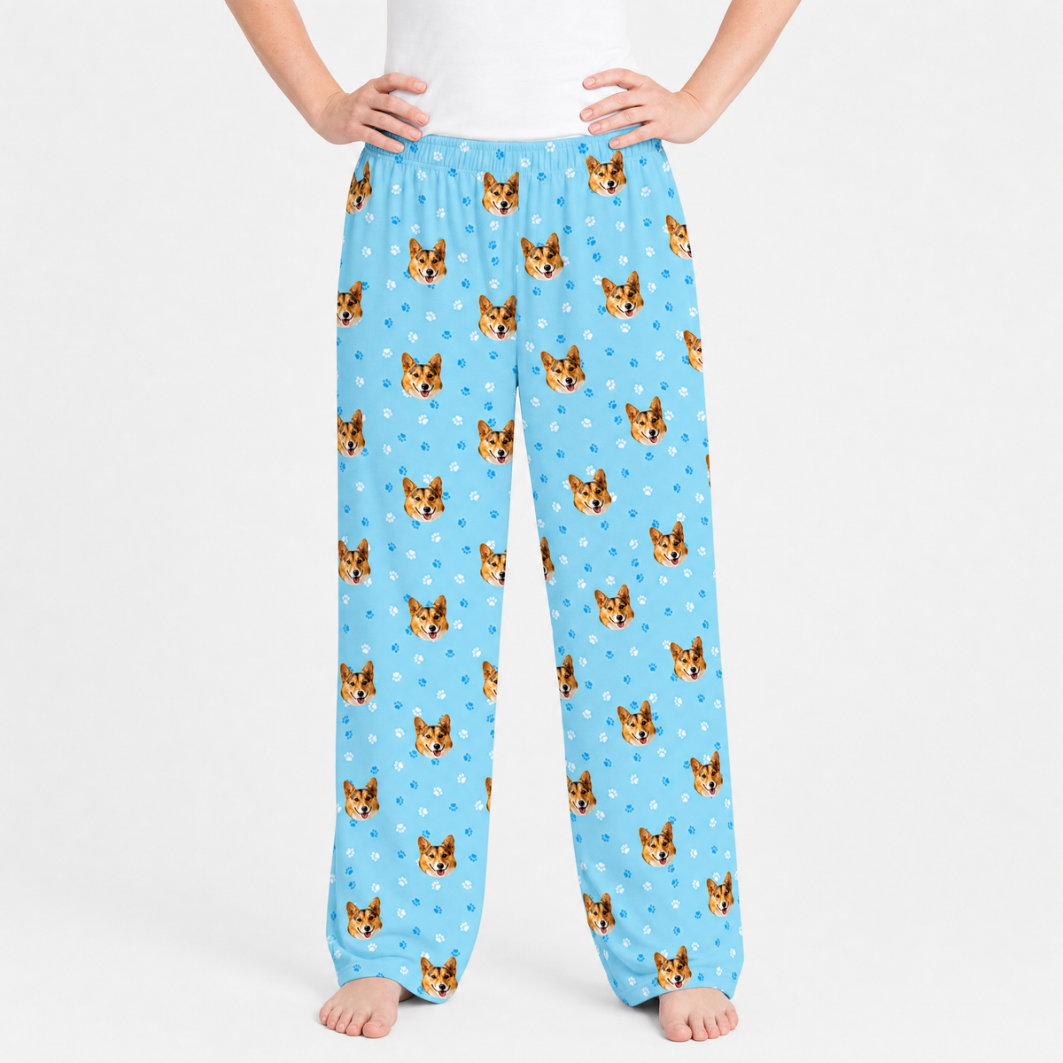 Blue pajama pants with dog pattern on a white background