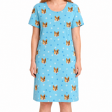 Light blue nightgown with dog pattern worn by a person on a white background