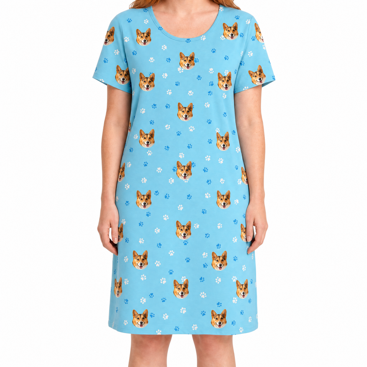 Light blue nightgown with dog pattern worn by a person on a white background