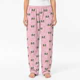 Pink pajama pants with dog pattern on a white background