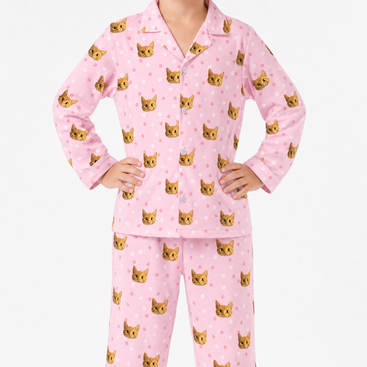 Pink pajama set with orange cat pattern on a white background