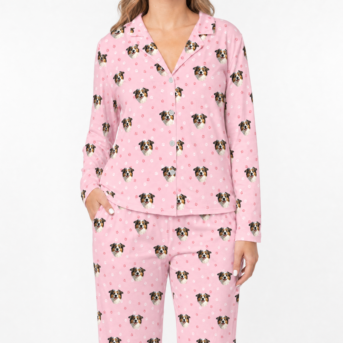 Pink pajama set with dog pattern on a white background