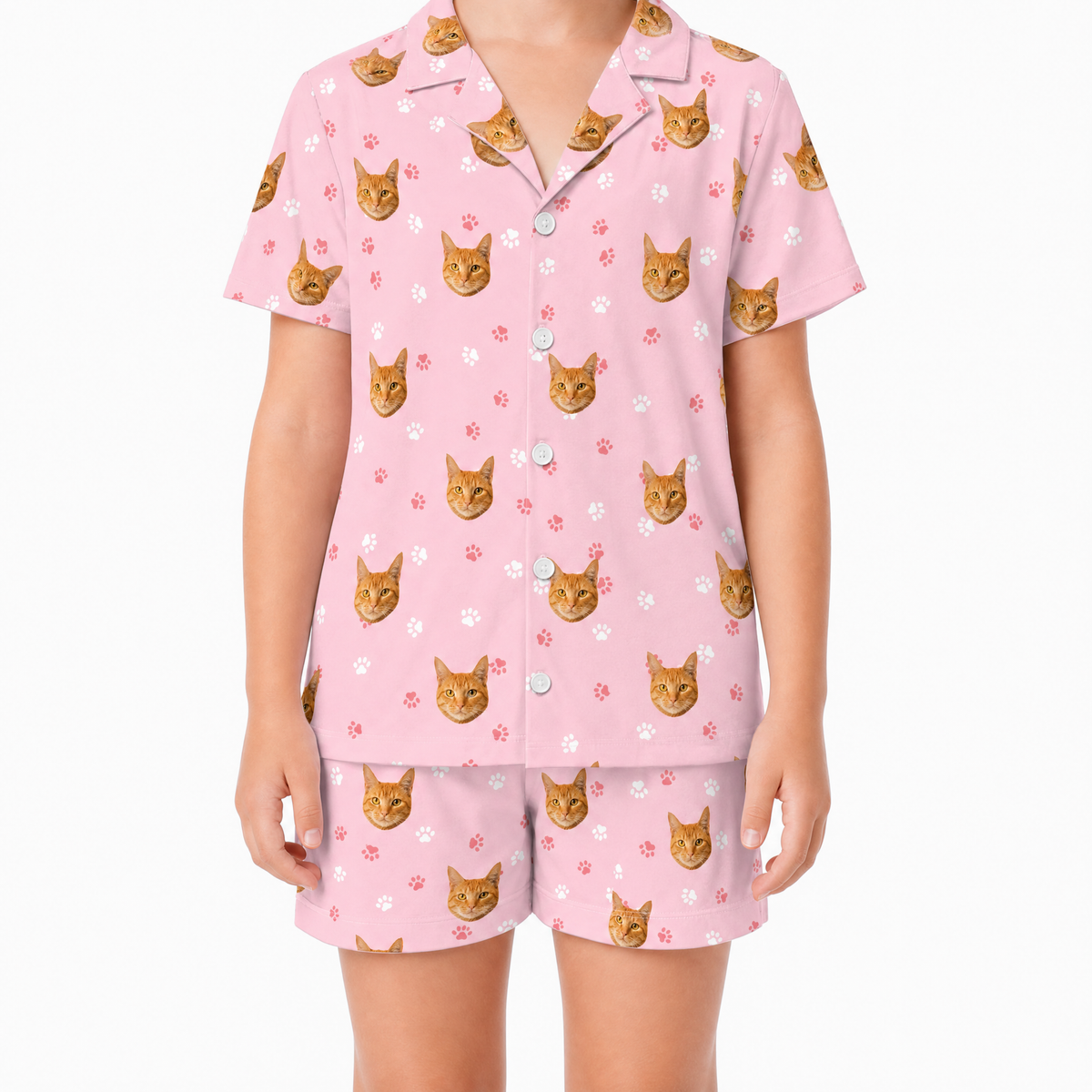 Pink pajama set with cat pattern on a white background