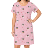 Pink nightgown with dog pattern on a white background