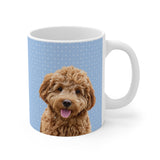 Custom 11oz ceramic mug with a curly goldendoodle photo cutout portrait on a light blue background with tiny white snowflakes[SnowflakesImageCutOut]