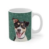 Custom 11oz ceramic mug with a tricolor terrier mix hand illustration portrait on a green background with sprigs of mistletoe[MistletoeHandIllustration]