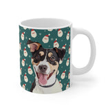 Custom 11oz ceramic mug with a tricolor terrier mix hand illustration portrait on a green background with a repeating Santa face pattern[SantaHandIllustration]