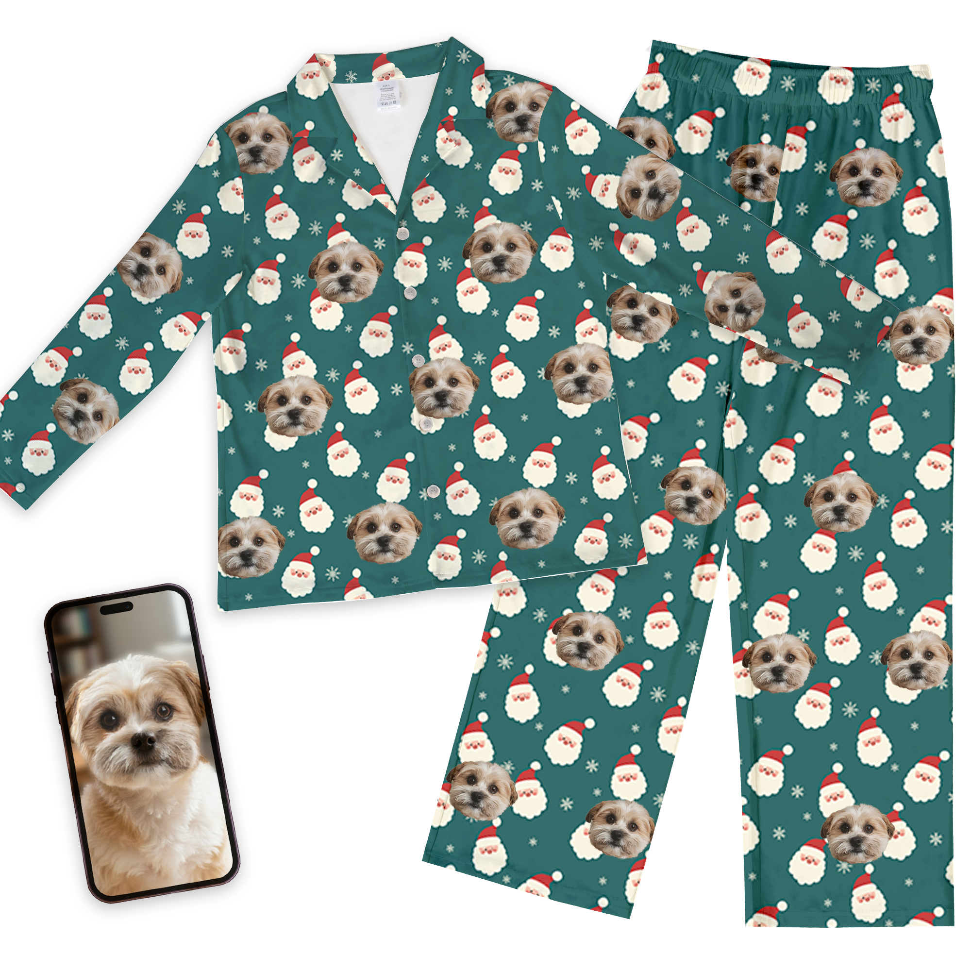 Custom pet face pajamas in teal long-sleeve set with repeating dog portraits, Santa hats, and snowflakes, shown with phone displaying original dog photo