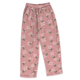 These are pajama pants in a pink color with repeating pet faces on them