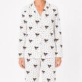 White pajama set with black dog pattern on a white background