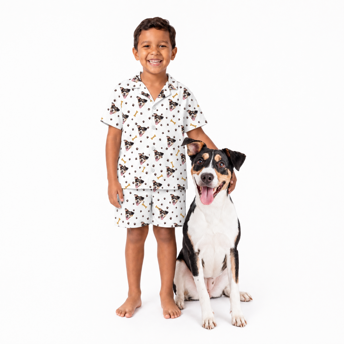 Child wearing a white patterned pajama set with a dog on a white background