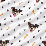 Close-up of the Paws and Bones print showing custom pet faces with brown paw prints and dog bones on a white fabric