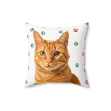 Custom 16 inch throw pillow with an orange tabby cat hand illustration portrait on a white background with red and green paw prints[ChristmasPawsHandIllustration]