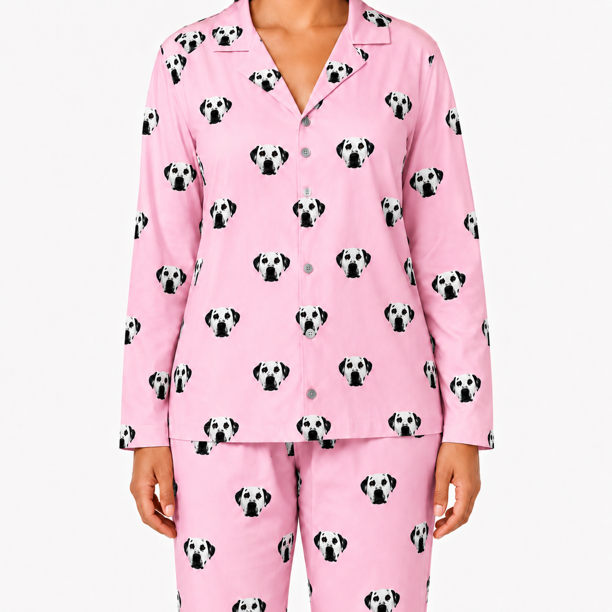 Pink pajama set with dog pattern on a white background