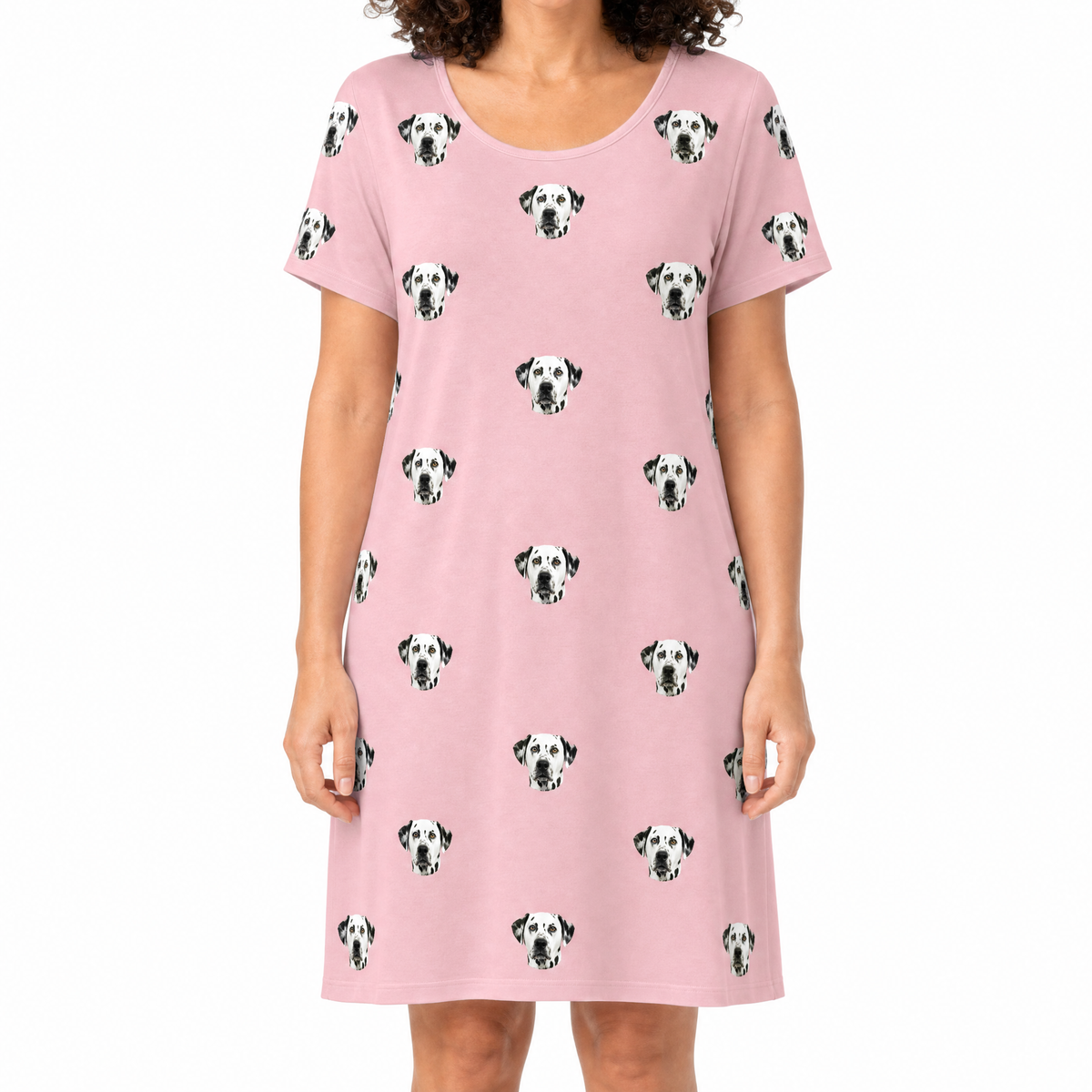 Pink nightgown with Dalmatian pattern worn by a person on a white background