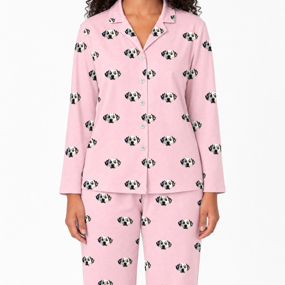 Pink pajama set with dog pattern on a white background